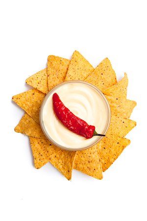 simsearch:400-06689258,k - Pepper dipped into a bowl of white dip surrounded by nachos Stock Photo - Budget Royalty-Free & Subscription, Code: 400-06689255