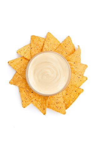 simsearch:400-06689258,k - Nachos placed around a bowl of white dip against a white background Stock Photo - Budget Royalty-Free & Subscription, Code: 400-06689252