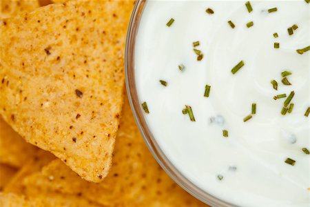 simsearch:400-06689258,k - Close up of a bowl of white dip with herbs  beside nachos Stock Photo - Budget Royalty-Free & Subscription, Code: 400-06689264