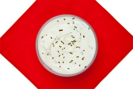 simsearch:400-06689258,k - Bowl of dip with herbs on a red napkin against a white background Stock Photo - Budget Royalty-Free & Subscription, Code: 400-06689260