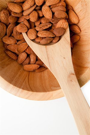 simsearch:400-09080000,k - Wooden spoon traditional with almonds in a bowl against a white background Stockbilder - Microstock & Abonnement, Bildnummer: 400-06689314
