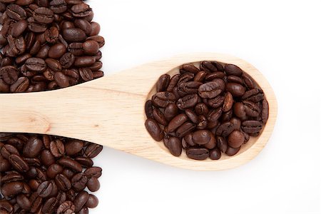 simsearch:400-06689258,k - Wooden spoon with coffee seeds against a white background Stock Photo - Budget Royalty-Free & Subscription, Code: 400-06689331