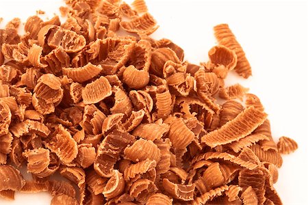 Chocolate shavings against a white background Stock Photo - Budget Royalty-Free & Subscription, Code: 400-06689394