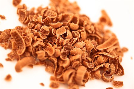 Many chocolate shavings against a white background Stock Photo - Budget Royalty-Free & Subscription, Code: 400-06689395