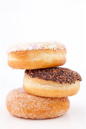 doughnut background - Pile of three doughnuts against a white background Stock Photo - Budget Royalty-Free & Subscription, Code: 400-06689526