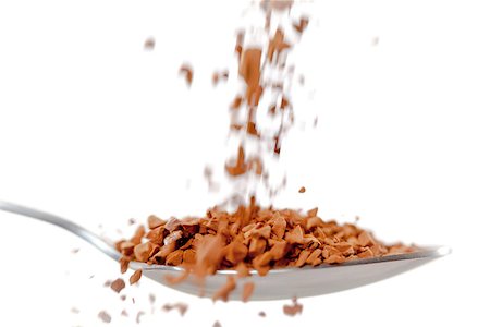 poudre de cacao - Chocolate powder falling in a spoon against white background Foto de stock - Super Valor sin royalties y Suscripción, Código: 400-06689574