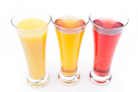 simsearch:400-06689686,k - Three glasses full of fruit juice against white background Foto de stock - Super Valor sin royalties y Suscripción, Código: 400-06689657
