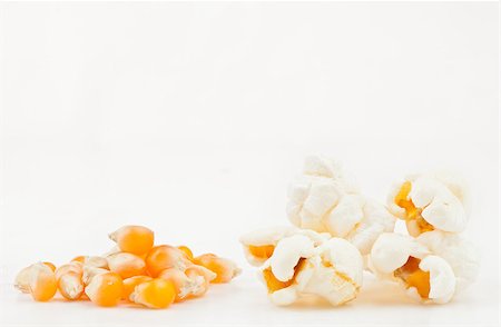 popcorn white background - Many corns and popcorn against a white background Stock Photo - Budget Royalty-Free & Subscription, Code: 400-06689725