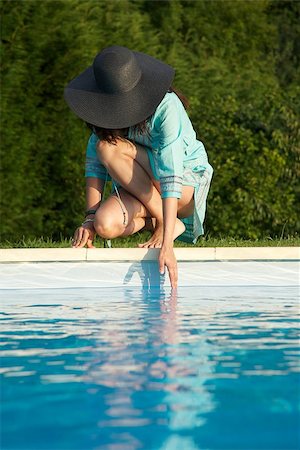 woman barefoot at swimming pool border in Asturias Spain Stock Photo - Budget Royalty-Free & Subscription, Code: 400-06694027