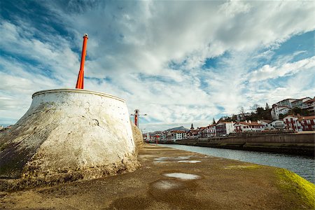 Entry of the Saint Jean de Luz harbor, the Ciboure village on the side and the Rhune Mountain in the distance. Stock Photo - Budget Royalty-Free & Subscription, Code: 400-06694091