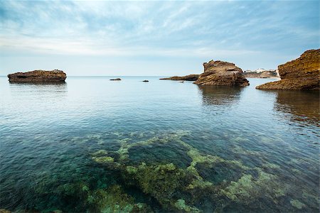 Seascape from Biarritz, France, Pays Basque. Rocks under a creamy sky. Clean transparent water. Stock Photo - Budget Royalty-Free & Subscription, Code: 400-06694093