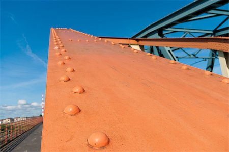 steel beams - orange painted steel structure of a bridge with bolts and nuts Stock Photo - Budget Royalty-Free & Subscription, Code: 400-06694158