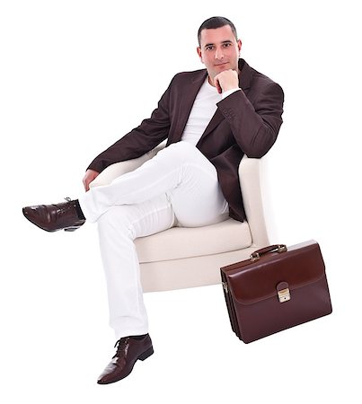 simsearch:400-04173616,k - Handsome young businessman sitting in armchair, over white background Stockbilder - Microstock & Abonnement, Bildnummer: 400-06694236