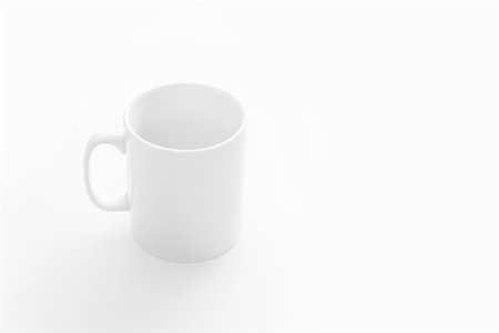 Big white empty cup on white table, front top view Stock Photo - Budget Royalty-Free & Subscription, Code: 400-06694666