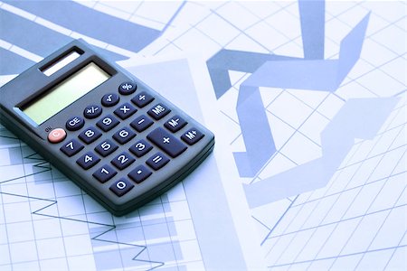 simsearch:400-06641055,k - Business concept. Calculator on paper background with business chart Stock Photo - Budget Royalty-Free & Subscription, Code: 400-06694737