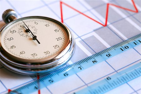 simsearch:400-06641055,k - Business concept. Closeup of stopwatch and ruler on paper background with business chart Stock Photo - Budget Royalty-Free & Subscription, Code: 400-06694742