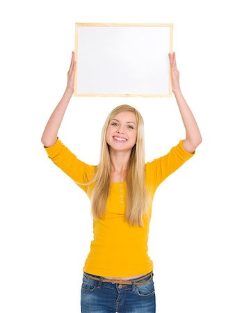 Happy student girl holding blank board over head Stock Photo - Budget Royalty-Free & Subscription, Code: 400-06694911