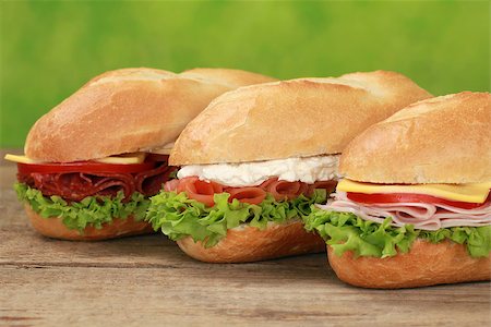 simsearch:400-06421213,k - Sub Sandwiches with pepperoni, ham, salmon, cheese, tomatoes and lettuce Foto de stock - Super Valor sin royalties y Suscripción, Código: 400-06695073