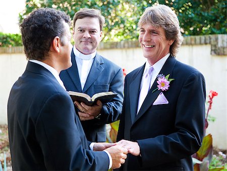 Gay couple exchanging rings and vows at their wedding. Stock Photo - Budget Royalty-Free & Subscription, Code: 400-06695205