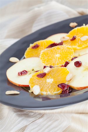 Healthy orange and apple salad with dried cranberries and roasted almonds Stock Photo - Budget Royalty-Free & Subscription, Code: 400-06695250