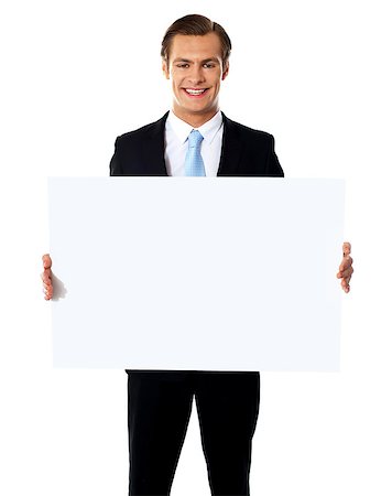 simsearch:400-05368656,k - Young businessman holding a blank billboard against white background Stockbilder - Microstock & Abonnement, Bildnummer: 400-06695504