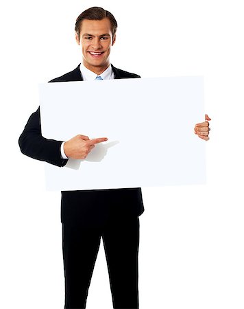 Male representative pointing towards placard, isolated on white Stock Photo - Budget Royalty-Free & Subscription, Code: 400-06695505