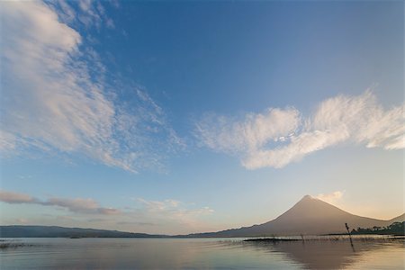 Volcano Arenal in the early morning with reflection in the water. Stock Photo - Budget Royalty-Free & Subscription, Code: 400-06696054