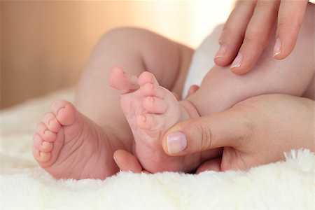 newborn baby feet on female hands Stock Photo - Budget Royalty-Free & Subscription, Code: 400-06696628