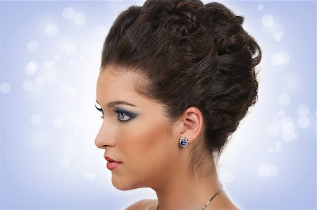 Young woman with beautiful hairstyle, make up and sapphire jewelry Foto de stock - Royalty-Free Super Valor e Assinatura, Número: 400-06696895