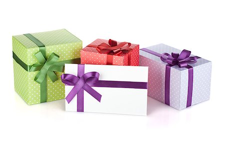 simsearch:400-06360703,k - Colorful gift boxes and letter with ribbon and bow. Isolated on white background Stockbilder - Microstock & Abonnement, Bildnummer: 400-06697288