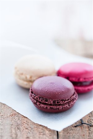 simsearch:400-06564979,k - Closeup of three different flavoured macaroons on wooden table Stock Photo - Budget Royalty-Free & Subscription, Code: 400-06697366
