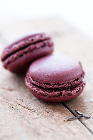 simsearch:400-06564979,k - Closeup of two chocolate macaroons on wooden table Stock Photo - Budget Royalty-Free & Subscription, Code: 400-06697361