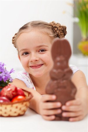 Happy easter girl with chocolate bunny and dyed eggs - closeup Photographie de stock - Aubaine LD & Abonnement, Code: 400-06698060