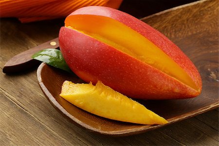 fresh fruit mango on wooden plate Stock Photo - Budget Royalty-Free & Subscription, Code: 400-06698255