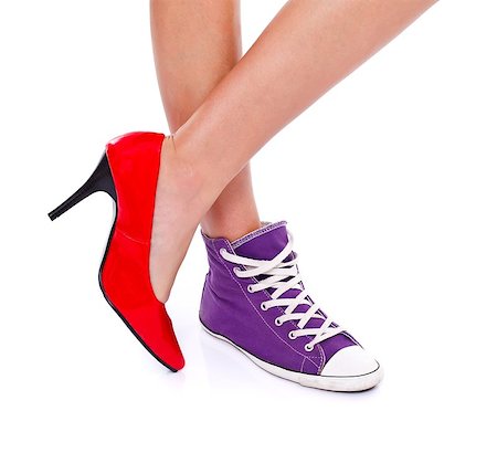 Woman wearing red high heel shoe on one leg and sport shoe on another leg Foto de stock - Royalty-Free Super Valor e Assinatura, Número: 400-06698345
