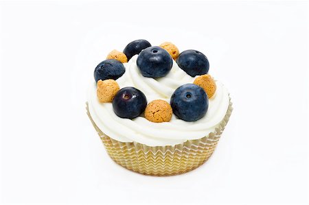 muffin with italian pastries called amaretti and blueberries  isolated in white background Stock Photo - Budget Royalty-Free & Subscription, Code: 400-06698415
