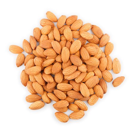 A heap of dried almonds isolated on white background Stock Photo - Budget Royalty-Free & Subscription, Code: 400-06698425