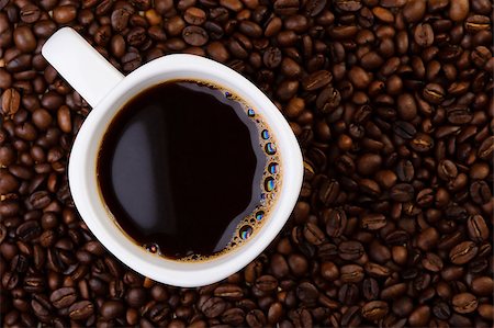 simsearch:400-06700189,k - Cup of coffee on aromatic coffee beans. top view Stock Photo - Budget Royalty-Free & Subscription, Code: 400-06698693