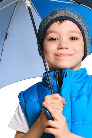 5 years old boy holding blue umbrella, isolated on white background Stock Photo - Budget Royalty-Free & Subscription, Code: 400-06698753