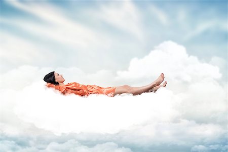 Beautiful girl, sleeping on a white cloud Stock Photo - Budget Royalty-Free & Subscription, Code: 400-06698858