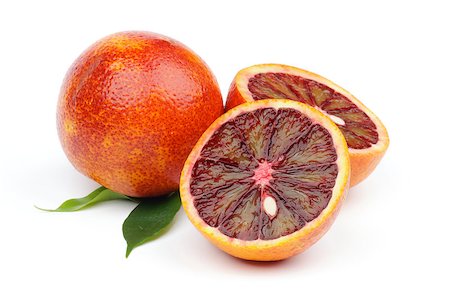 simsearch:400-05265200,k - Ripe Blood Oranges Full Body and Two Halves isolated on white background Photographie de stock - Aubaine LD & Abonnement, Code: 400-06699194