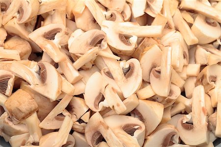 simsearch:400-07217319,k - Fresh sliced Mushrooms Champignons closeup backdrop Stock Photo - Budget Royalty-Free & Subscription, Code: 400-06699233