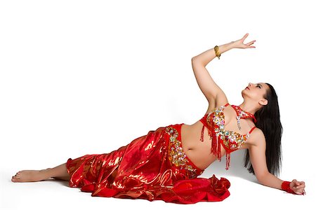 photovova (artist) - Beautiful young girl in a red suit oriental dance in motion isolated on white background Foto de stock - Super Valor sin royalties y Suscripción, Código: 400-06699250