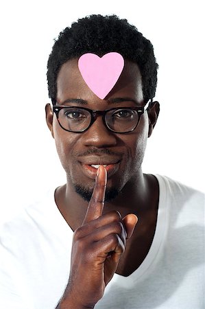 eyeglasses forehead - Man with pape heart on forehead gesturing silence, closeup shot Stock Photo - Budget Royalty-Free & Subscription, Code: 400-06699819