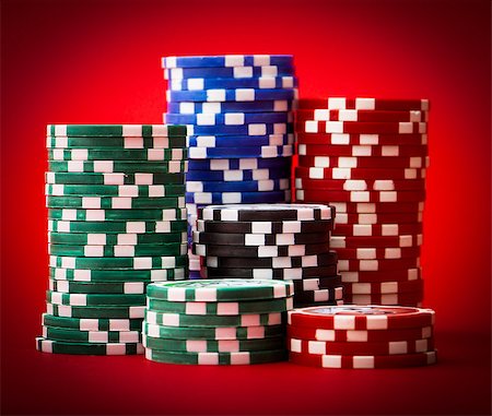 simsearch:400-04672615,k - colour chips for poker on red table Stock Photo - Budget Royalty-Free & Subscription, Code: 400-06699854