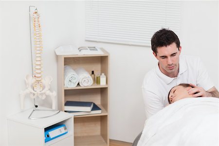 Neck of woman being manipulated by the chiropractor in a medical room Stock Photo - Budget Royalty-Free & Subscription, Code: 400-06690023