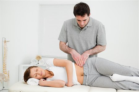 Peaceful woman being massaged on her hip by a doctor in a medical room Stock Photo - Budget Royalty-Free & Subscription, Code: 400-06690038