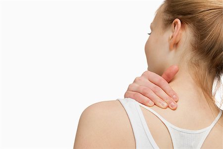 simsearch:400-06690149,k - Woman massaging her painful neck against white background Stock Photo - Budget Royalty-Free & Subscription, Code: 400-06690139