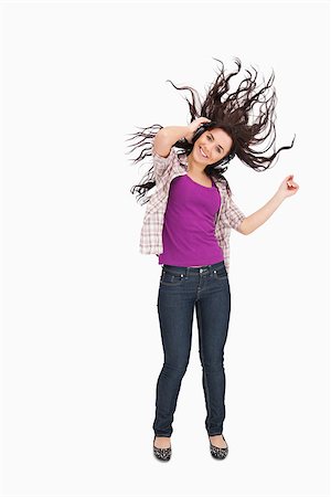 simsearch:400-06690896,k - Brunette listening to music with her hair in the hair against white background Stock Photo - Budget Royalty-Free & Subscription, Code: 400-06690896