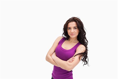 simsearch:400-06690896,k - Brunette with arms crossed in purple tank top against white background Stock Photo - Budget Royalty-Free & Subscription, Code: 400-06690990